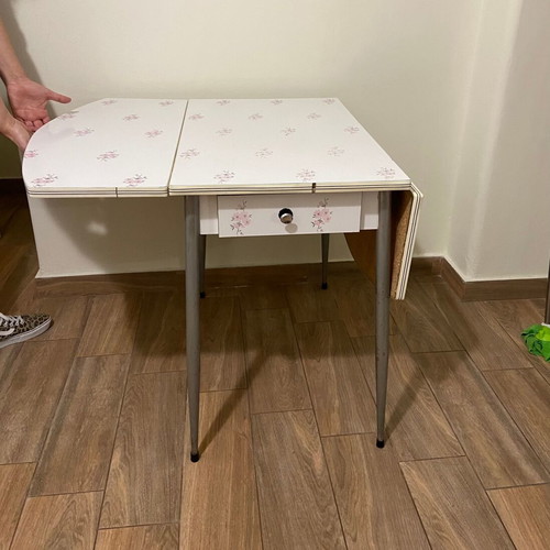 Formica kitchen table used, extendable with almond blossom design and drawer