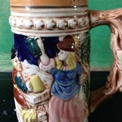 Decorative ceramic beer mug like new with embossed designs