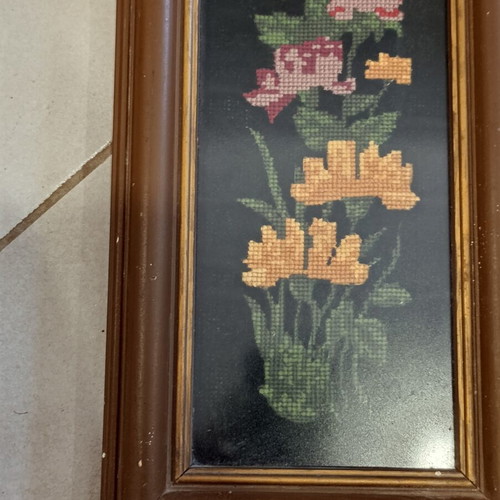Vintage handmade embroidered textile painting in frame with glass