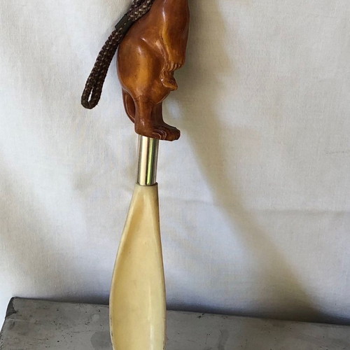 Shoe brush and shoehorn set used with kangaroo sculpture
