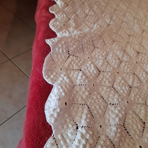 Handmade white crochet blanket in vintage style