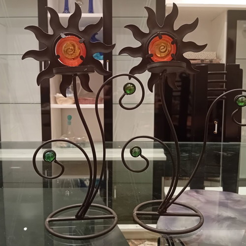 Decorative candle holders set of two used, wrought iron sun design