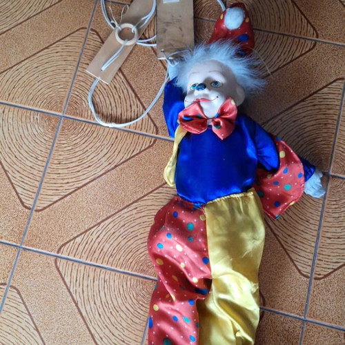 Porcelain puppet theater clown doll