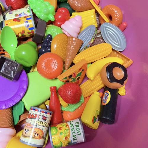 Children's toys used with plastic kitchen items, fruits, vegetables