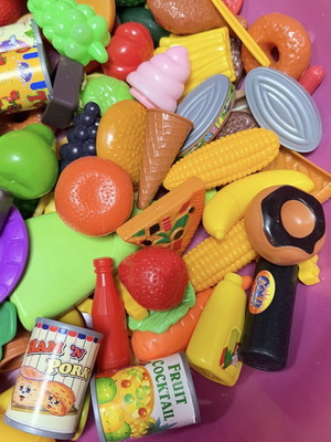 Children's toys used with plastic kitchen items, fruits, vegetables