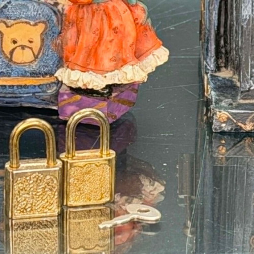 Vintage polyresin piggy banks with three locks and working key