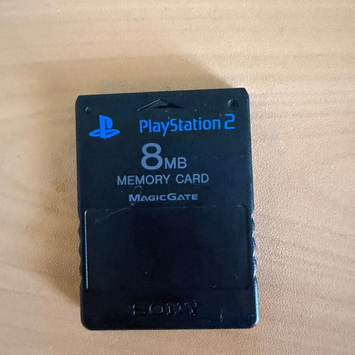 PlayStation 2 Slim console with original Sony accessories