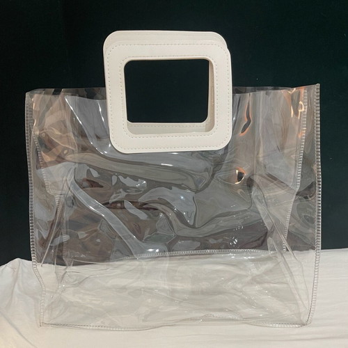 Transparent women handbag like new with white handle