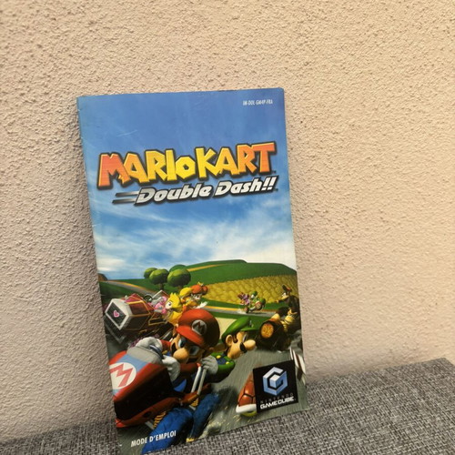 GameCube empty cases with Mario manual