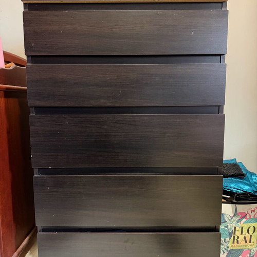 Dark brown wooden chest of drawers used with minimal wear