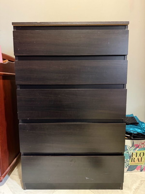 Dark brown wooden chest of drawers used with minimal wear