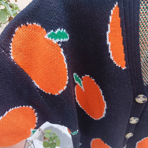 Knitted winter cardigan with buttons one size new, black with orange fruit design