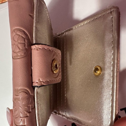 Guess wallet used, small size, pink with many compartments