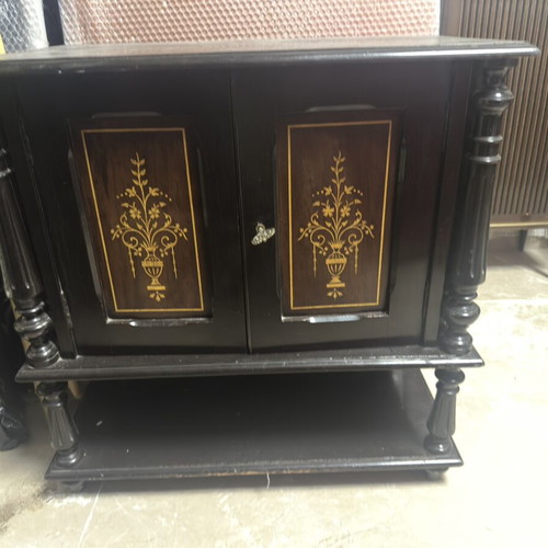 Vintage wooden cabinet used with decorative gold inlay