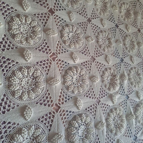 Handmade super double blanket with embossed designs and crocheted fringes