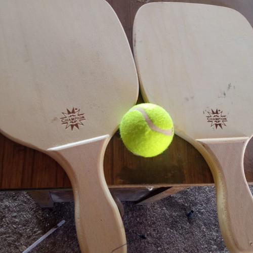 Wooden rackets with ball used, minor imperfections