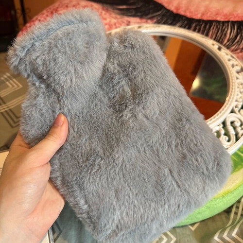 Hot water bottle with furry cover like new, cozy and warm