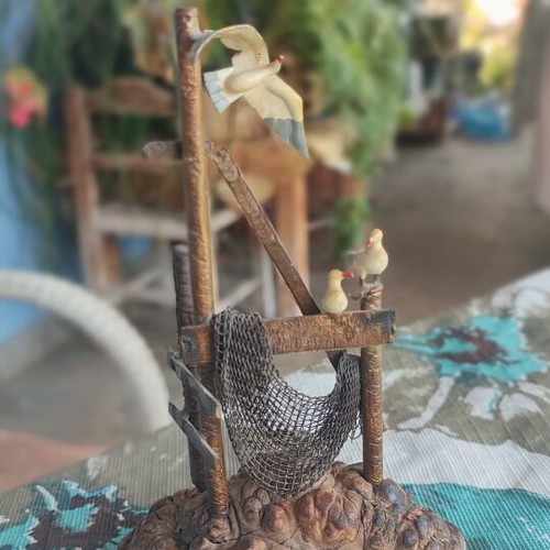 Vintage sea-themed decoration handmade from metal and cork used