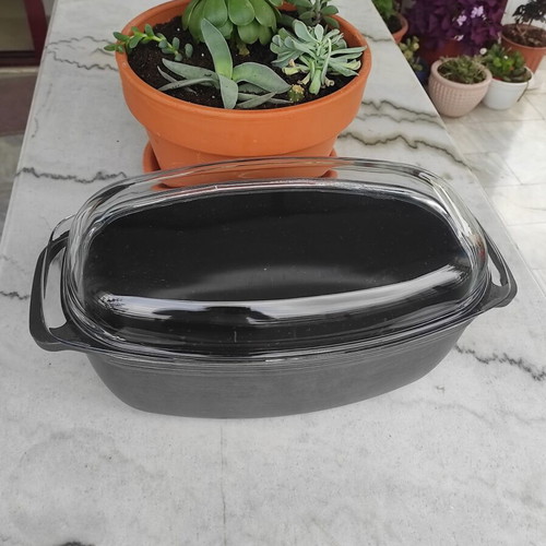 Glass Pyrex and cast iron pot used with surface wear