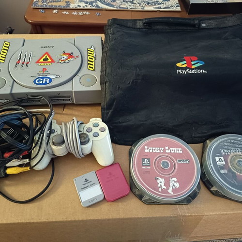 Playstation 1 console used with dual shock controller and accessories