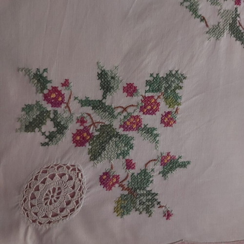 Handmade counted embroidery with handmade lace used