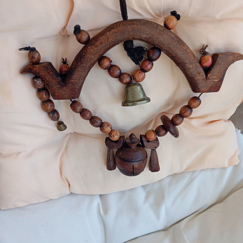Asian decorative wooden item with brass bell used