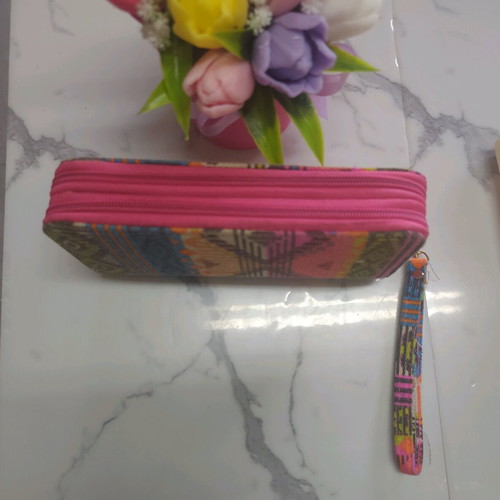 Ethnic wallet with colorful geometric patterns and wrist strap