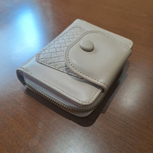 Beige wallet like new with zipper and card slots
