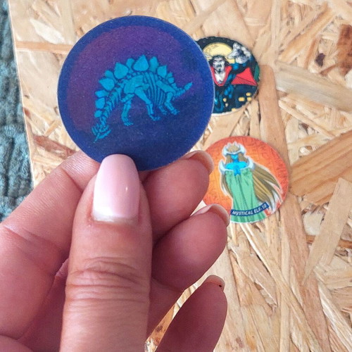 Set of 5 vintage collectible pogs from Spiderman, Yu Gi Oh and dinosaur collections