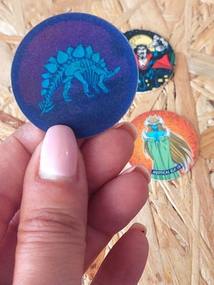 Set of 5 vintage collectible pogs from Spiderman, Yu Gi Oh and dinosaur collections