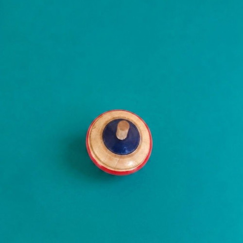 Wooden spinning top with hand-painted folk art design