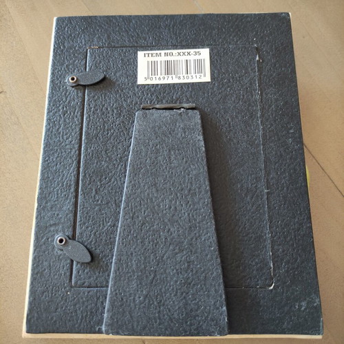 Ceramic photo frame with embossed flower and notes, used