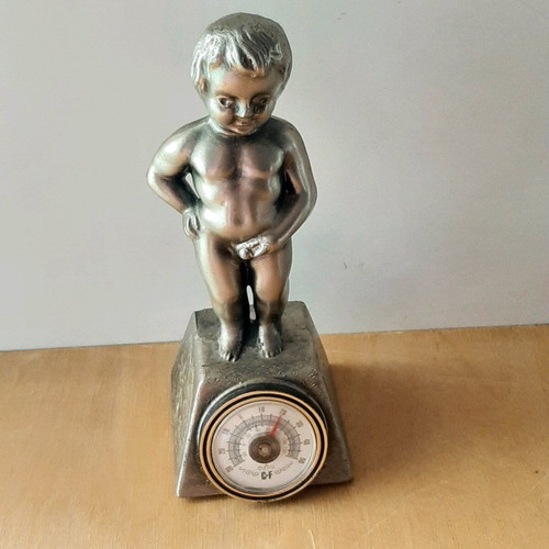 Vintage metal thermometer with small child figure like new