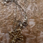 Silver cross used with small diamond