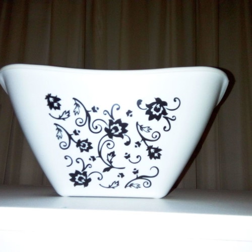 Black and white plant pot used, medium size, plastic