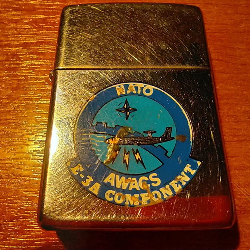 Collectible Zippo lighter 32 years old and handmade Okapi knife.