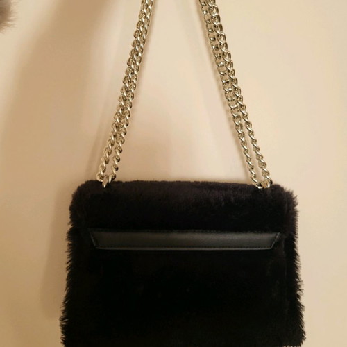 Fur shoulder bag new with leatherette and metal clasp