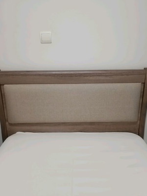 Wooden bedroom set with semi-double bed, nightstand, and chest of drawers