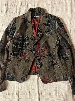 Brown jacket with burgundy patterns and details