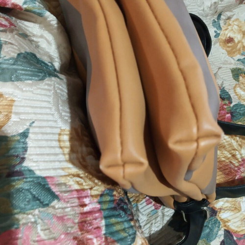 Bag with adjustable strap with minor corner wear