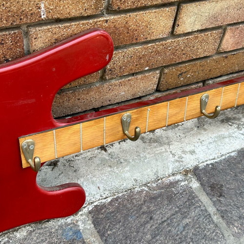 Wall hanger in electric guitar shape used, handmade with metal hooks