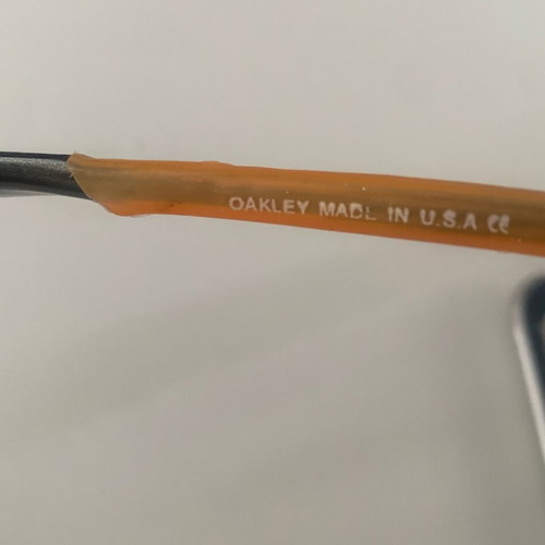 Oakley sunglasses, orange with gold lime chameleon lenses