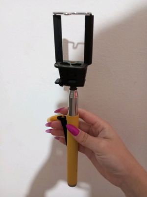 Selfie stick used with buttons