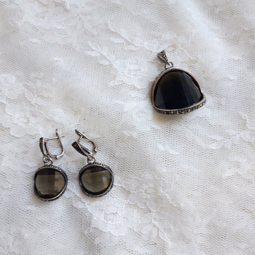 Silver set used with green transparent stones and marcasite