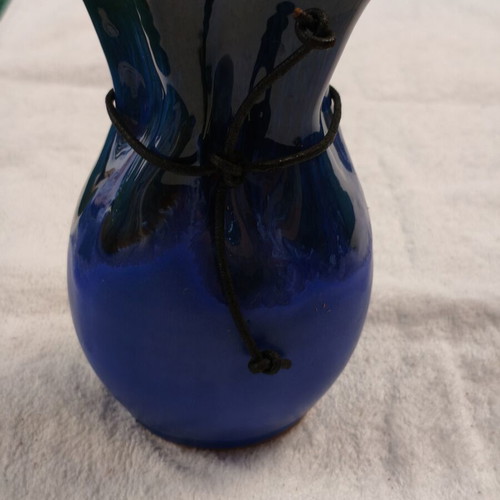 Handmade ceramic vase with blue drip glaze