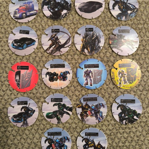 Transformers and Monsuno caps like new, pack of 28