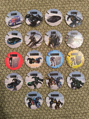Τάπες transformers και monsuno σαν καινούργιο, πακέτο 28