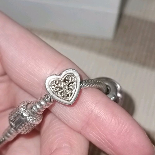 Pandora silver bracelet with 11 charms and collectible clasp, like new