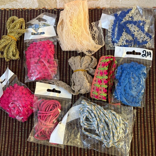 Decorative ribbons, cords, lace and craft elements like new