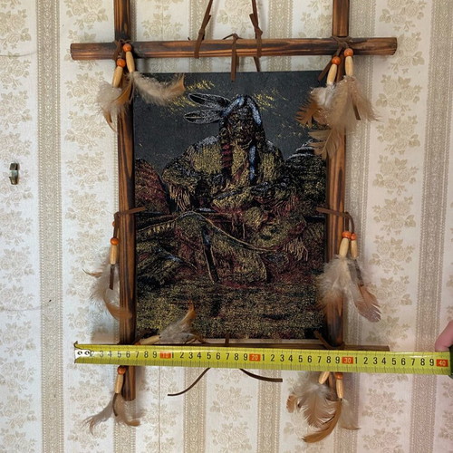 Wall decor like new with Native American figure and feathers